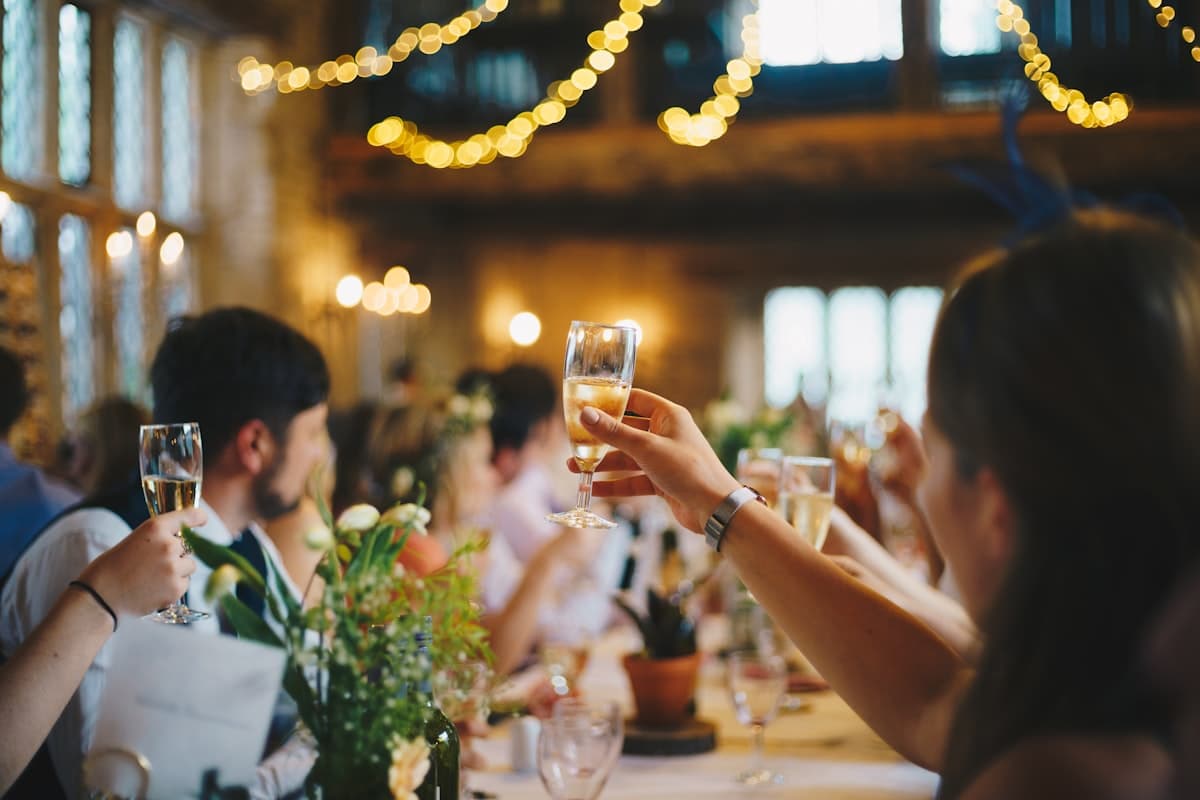 Guests raising glasses for a toast