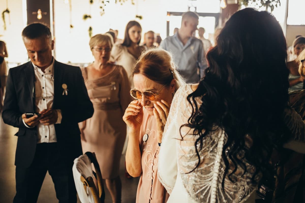 An emotional embrace between guests
